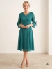 Elegancka zielona sukienka midi rozkloszowana w grochy – kobiecy krój z ozdobnym dekoltem 38293