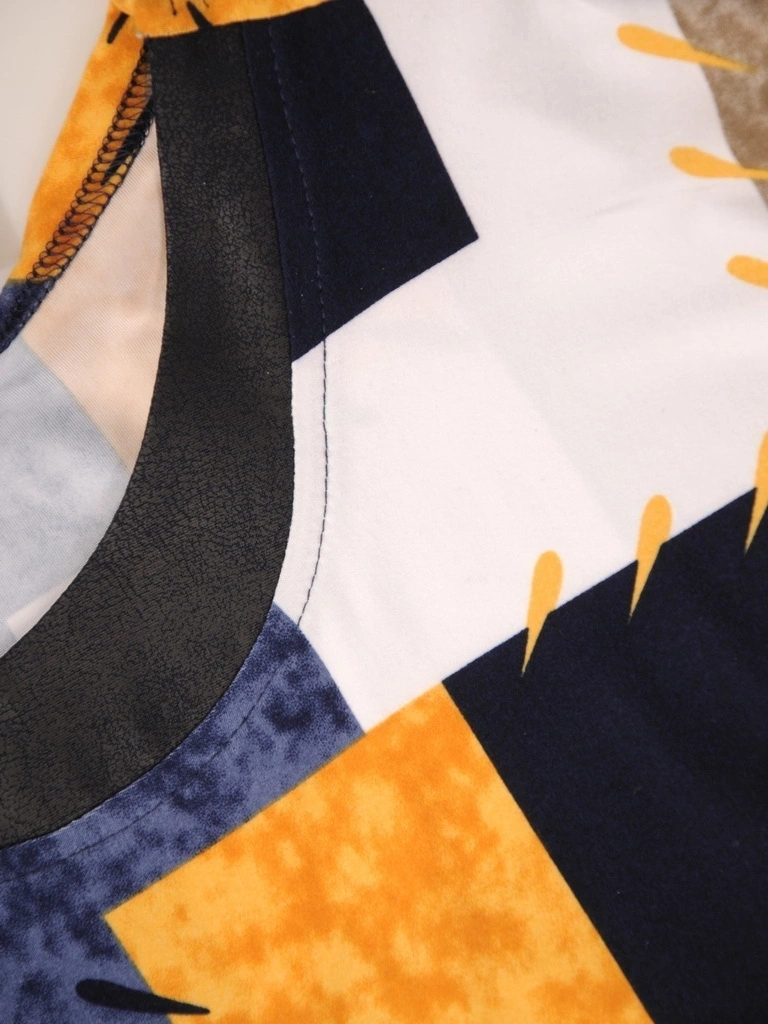 Wielobarwna bluzka damska z ekoskórą w modny patchwork – fason kimono, maskujący talię i wysmuklający plecy 32505
