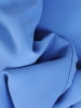 Niebieski komplet damski ze spodniami na wesele – trapezowa tunika z kokardą wysmuklająca figurę 37446