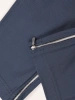 Eleganckie niebieskie spodnie damskie na gumce – dopasowany fason ze stylowymi suwakami 34875